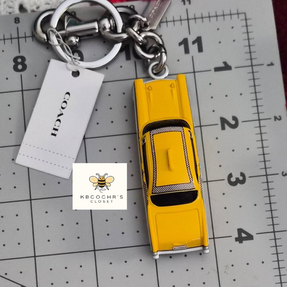 Coach Small Taxi Bag Charm CY396 - 𝐒𝐨𝐥𝐝 𝐎𝐮𝐭 𝐀𝐜𝐫𝐨𝐬𝐬 𝐂𝐨𝐚𝐜𝐡 -